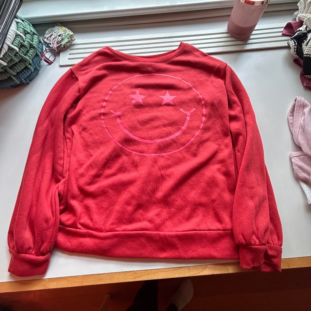 Red Sweater with a smiley Face